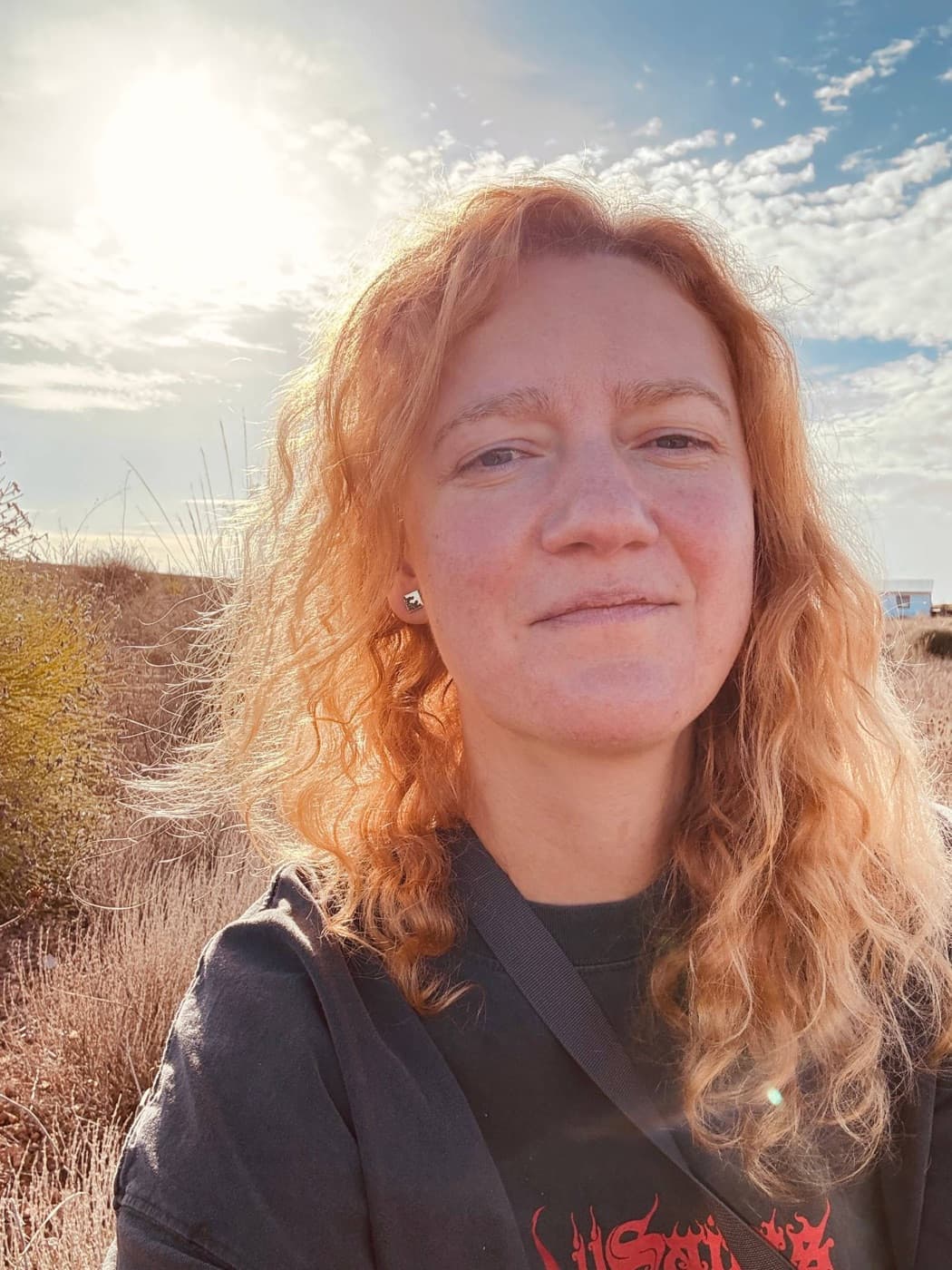 Vaiva Rivas smiling in a sunny field